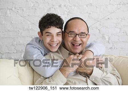 Hispanic grandfather and grandson hugging View Large Photo Image Stock Image - Hispanic grandfather and grandson hugging. Fotosearch