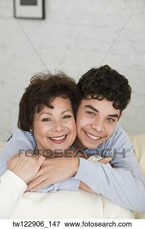 Hispanic grandmother and grandson hugging View Large Photo Image Stock Photo - Hispanic grandmother and grandson hugging. Fotosearch