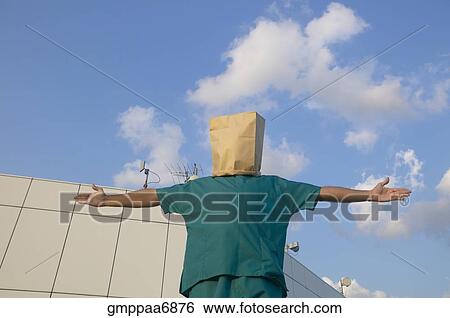 Hispanic male doctor wearing bag over head View Large Photo Image Stock Photograph - Hispanic male doctor wearing bag over head. Fotosearch