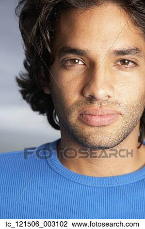 Hispanic man looking serious View Large Photo Image Stock Image - Hispanic man looking serious. Fotosearch