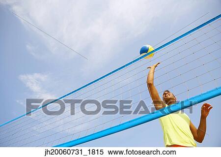 Hispanic man playing volleyball View Large Photo Image Stock Photography - Hispanic man playing volleyball. Fotosearch