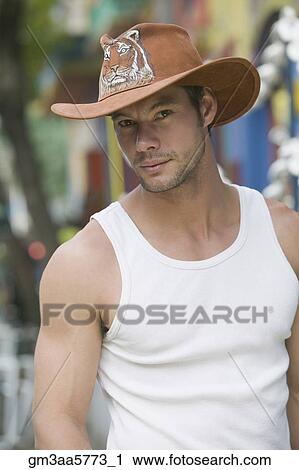Hispanic man wearing cowboy hat View Large Photo Image Stock Image - Hispanic man wearing cowboy hat. Fotosearch