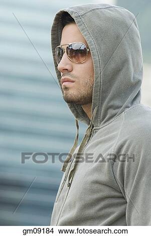 Hispanic man wearing hood and sunglasses View Large Photo Image Picture - Hispanic man wearing hood and sunglasses. Fotosearch