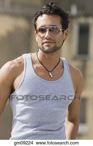 Hispanic man wearing sunglasses View Large Photo Image Picture - Hispanic man wearing sunglasses. Fotosearch
