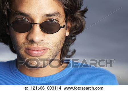 Hispanic man wearing sunglasses View Large Photo Image Picture - Hispanic man wearing sunglasses. Fotosearch