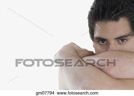 Hispanic man with head resting in arms View Large Photo Image Picture - Hispanic man with head resting in arms. Fotosearch