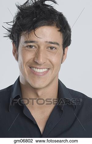 Hispanic man with messy hair View Large Photo Image Stock Image - Hispanic man with messy hair. Fotosearch