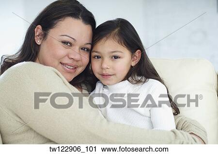 Hispanic mother and daughter hugging View Large Photo Image Stock Image - Hispanic mother and daughter hugging. Fotosearch