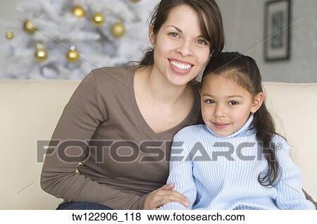 Hispanic mother and daughter hugging View Large Photo Image Stock Photo - Hispanic mother and daughter hugging. Fotosearch