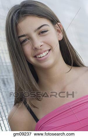 Stock Photo - Hispanic teenage girl smiling. Fotosearch