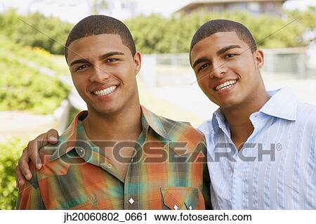 Hispanic twin brothers hugging View Large Photo Image Stock Image - Hispanic twin brothers hugging. Fotosearch