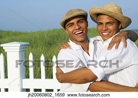 Hispanic twin brothers hugging View Large Photo Image Stock Photo - Hispanic twin brothers hugging. Fotosearch