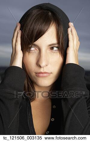 Hispanic woman covering ears with hands View Large Photo Image Stock Photography - Hispanic woman covering ears with hands. Fotosearch