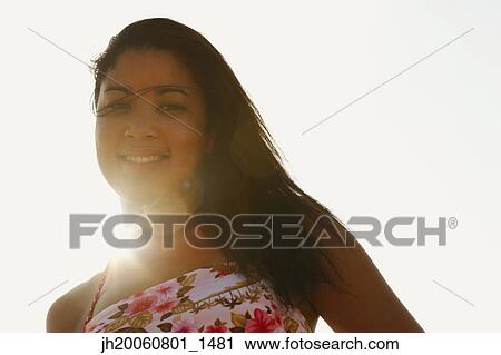 Hispanic woman in sunlight View Large Photo Image Stock Image - Hispanic woman in sunlight. Fotosearch