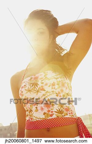 Stock Photo - Hispanic woman in sunlight. Fotosearch