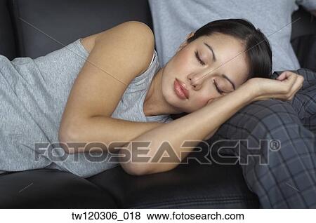 Hispanic woman sleeping on boyfriend’s leg View Large Photo Image Stock Photo - Hispanic woman sleeping on boyfriend’s leg. Fotosearch