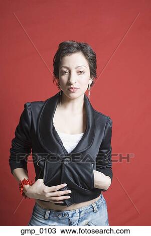 Stock Image - Hispanic woman wearing funky jacket. Fotosearch
