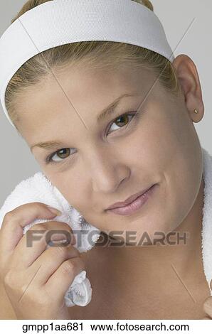 Stock Image - Hispanic woman wearing headband. Fotosearch