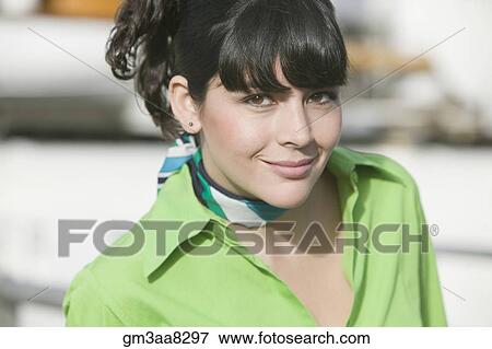 Stock Photo - Hispanic woman wearing scarf around neck. Fotosearch