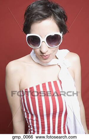 Stock Photograph - Hispanic woman wearing sunglasses. Fotosearch