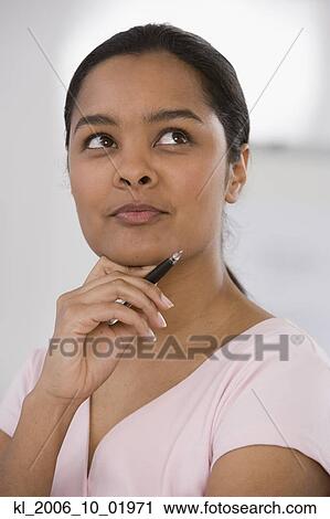 Stock Image - Indian businesswoman thinking. Fotosearch