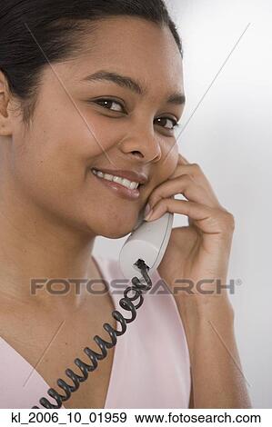 Stock Photo - Indian woman talking on telephone. Fotosearch
