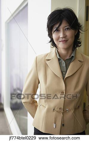 Kazakh woman standing in doorway View Large Photo Image Stock Photo - Kazakh woman standing in doorway. Fotosearch