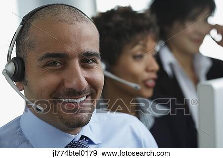 Middle Eastern businessman wearing headset View Large Photo Image Stock Photo - Middle Eastern businessman wearing headset. Fotosearch