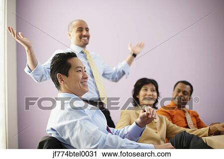 Multi-ethnic businesspeople at meeting View Large Photo Image Stock Image - Multi-ethnic businesspeople at meeting. Fotosearch