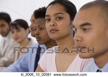 Stock Image - Multi-ethnic businesspeople at meeting. Fotosearch