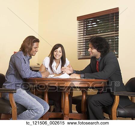Multi-ethnic businesspeople having meeting View Large Photo Image Stock Photography - Multi-ethnic businesspeople having meeting. Fotosearch