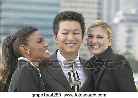 Stock Image - Multi-ethnic businesspeople outdoors. Fotosearch