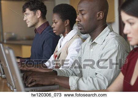 Multi-ethnic people typing on laptops View Large Photo Image Stock Image - Multi-ethnic people typing on laptops. Fotosearch