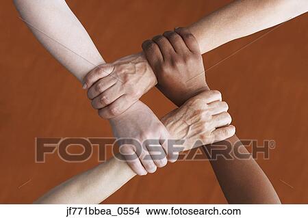Multi-ethnic women holding wrists View Large Photo Image Picture - Multi-ethnic women holding wrists. Fotosearch