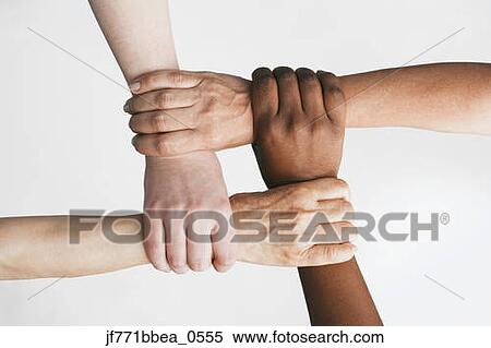 Multi-ethnic women holding wrists View Large Photo Image Stock Photography - Multi-ethnic women holding wrists. Fotosearch