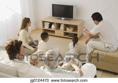 Multi-generational Hispanic family watching television View Large Photo Image Stock Image - Multi-generational Hispanic family watching television. Fotosearch