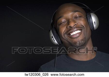 Portrait of African man wearing headphones View Large Photo Image Stock Photograph - Portrait of African man wearing headphones. Fotosearch
