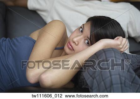Portrait of Asian woman laying on boyfriend’s leg View Large Photo Image Stock Image - Portrait of Asian woman laying on boyfriend’s leg. Fotosearch