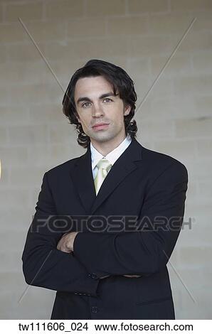 Picture - Portrait of businessman with arms crossed. Fotosearch