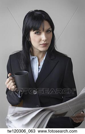 Portrait of businesswoman holding newspaper View Large Photo Image Stock Image - Portrait of businesswoman holding newspaper. Fotosearch