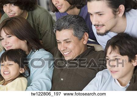 Portrait of Hispanic family on sofa View Large Photo Image Stock Photo - Portrait of Hispanic family on sofa. Fotosearch