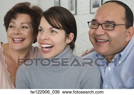 Portrait of Hispanic parents and adult daughter View Large Photo Image Stock Photograph - Portrait of Hispanic parents and adult daughter. Fotosearch