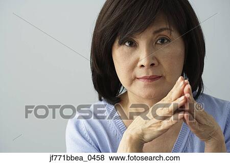 Stock Photo - Portrait of senior Asian woman . Fotosearch