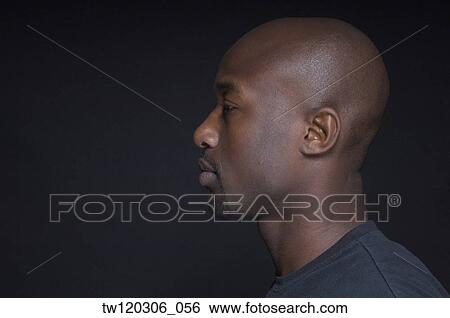 Profile of African man wearing t-shirt View Large Photo Image Stock Photograph - Profile of African man wearing t-shirt. Fotosearch