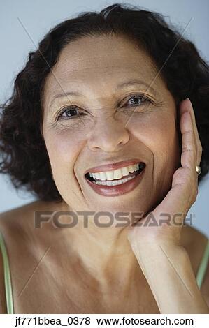 Senior African woman resting chin in hand View Large Photo Image Stock Photo - Senior African woman resting chin in hand. Fotosearch