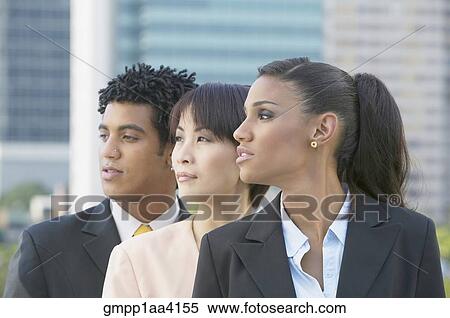 Three businesspeople looking to side View Large Photo Image Stock Photography - Three businesspeople looking to side. Fotosearch