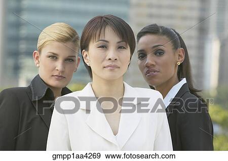 Three multi-ethnic businesswomen outdoors View Large Photo Image Stock Photo - Three multi-ethnic businesswomen outdoors. Fotosearch
