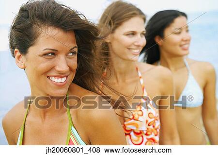 Three woman wearing bathing suits View Large Photo Image Stock Photo - Three woman wearing bathing suits. Fotosearch