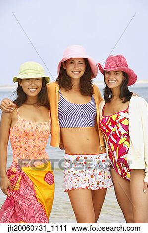 Three young women at beach View Large Photo Image Stock Image - Three young women at beach. Fotosearch