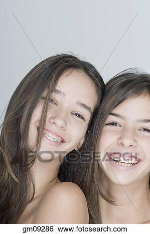 Two Hispanic teenage girls smiling View Large Photo Image Stock Photograph - Two Hispanic teenage girls smiling. Fotosearch